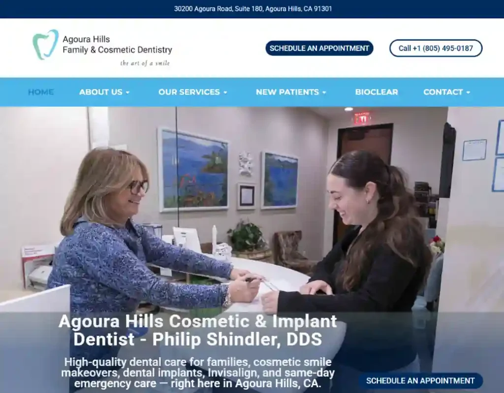 Agoura Hills Family & Cosmetic Dentistry website homepage showing a patient speaking with a dental office team member, developed by Spark Growth Works.